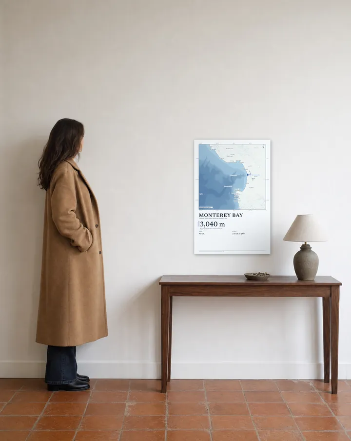 Generated scene: an entryway, above a walnut console. On the wall, our real Watercolour drawing of Monterey Bay at 20 × 30 in, set at true scale beside a woman 5 ft 7 in tall.